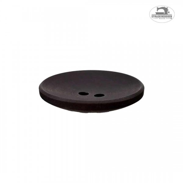 En svart mellanstor knapp sedd i profil.