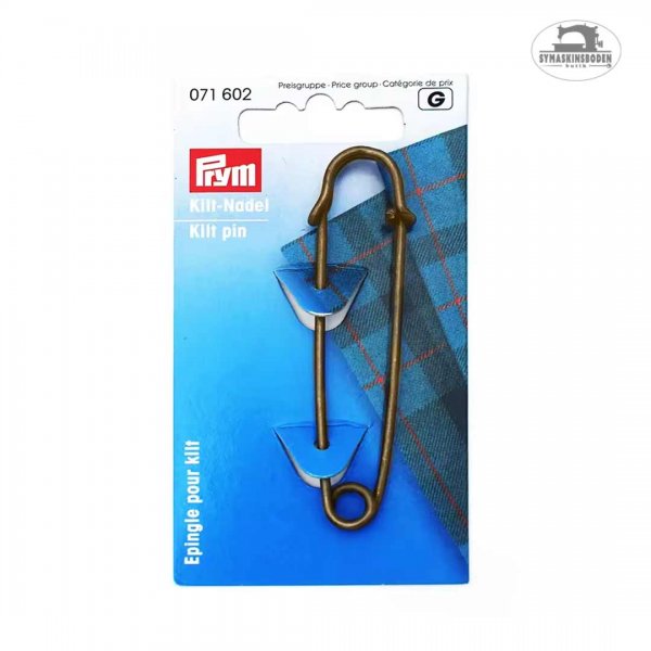 En stor kiltnål i förpackning