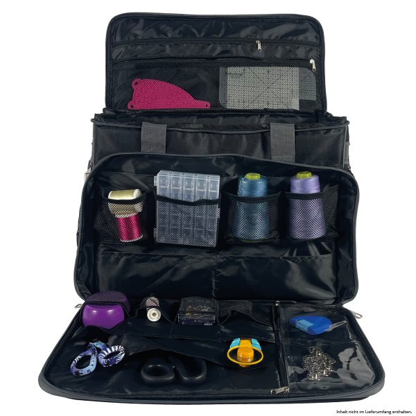 Fack för tillbehör och sybehör på en svart symaskinsväska