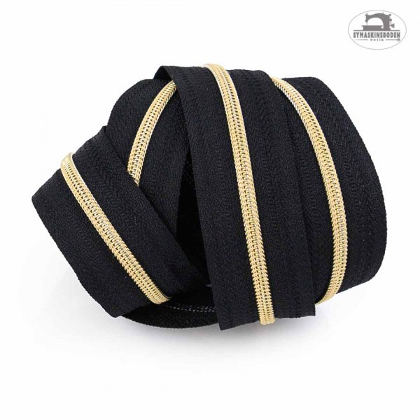 en ihoprullad bunt med blixtlas pa metervara i guld