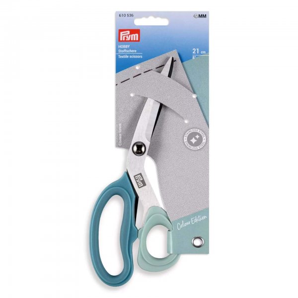 extilsax Hobby 21 cm monterad i originalförpackning (blå/vit kartong). Förpackningen anger produktnamnet HOBBY Stoffschere Texti