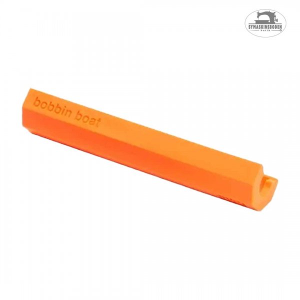 En orange silikonform som håller i undertrådsspolar