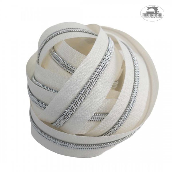 en bunt en vit blixtlasmetervara med silverspiral