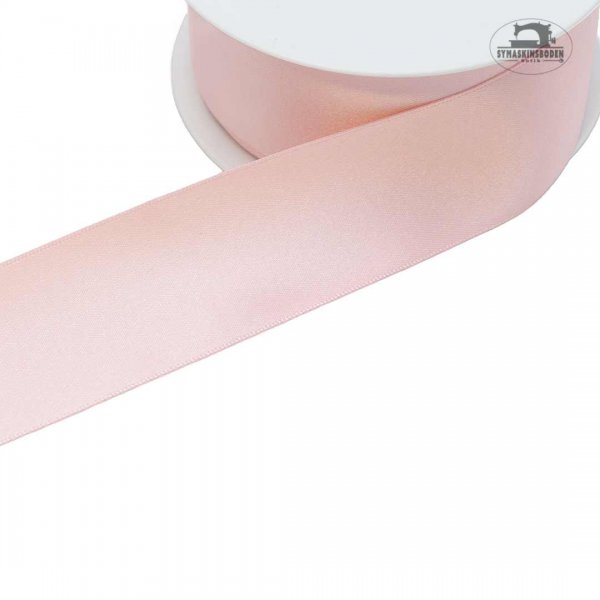 Ljusrosa satinband som är 35mm brett