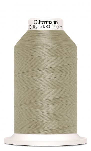 En rulle med beige bulky-lock tråd