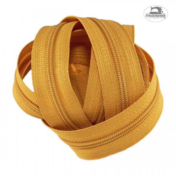 En bunt med blixtlås med färgen lejongul