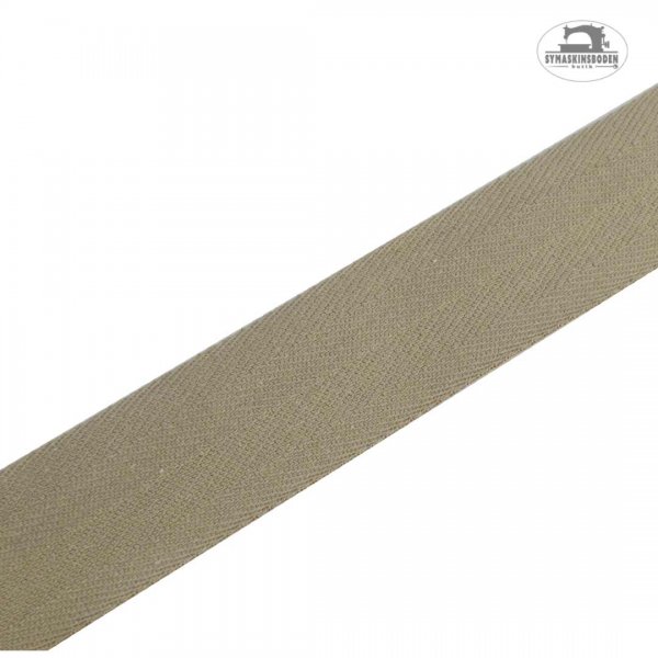 Ett kyprat bomullsband med 30mm bredd i färgen beige