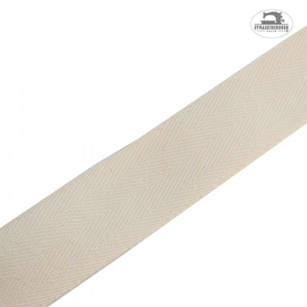 Ett kyprat bomullsband i naturvit med 30 mm bredd