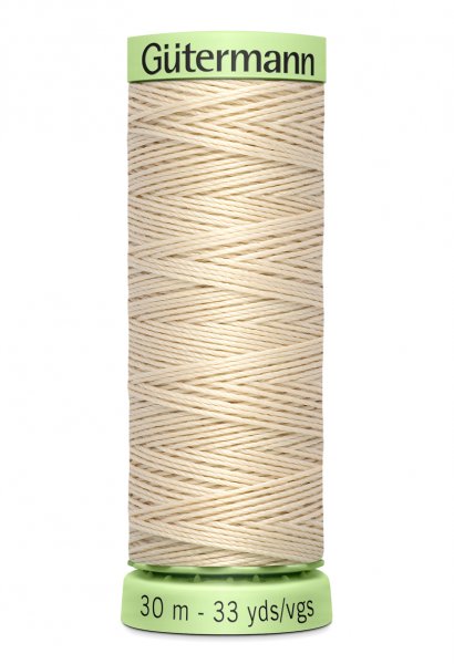 En rulle med ljusbeige top stitch tråd