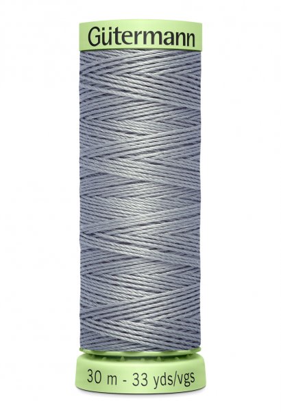En rulle med grå top stitch tråd