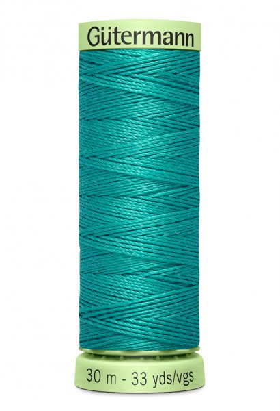 En rulle grön top stitch tråd