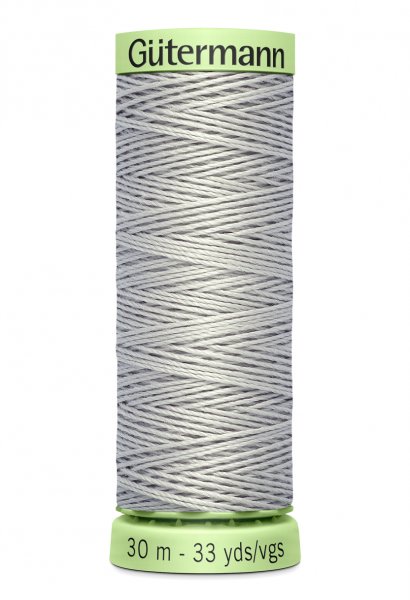 En rulle med grå top stitch tråd