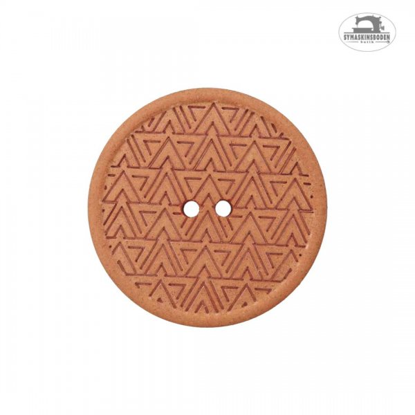 En orange knapp med struktur mönster av trianglar.