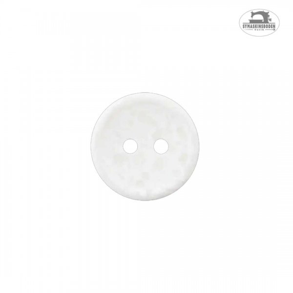 En liten vit skjortknapp med terazzo-effekt.