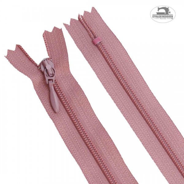 Ett rosa blixtlås till klänningar och kjolar i längd 25 cm