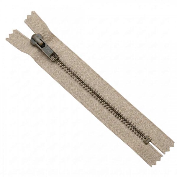 Ett 15cm långt blixtlås till byxor och jeans i beige färg.