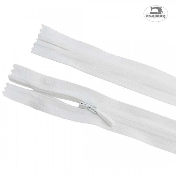 Ett dolt blixtlås i färgen vit och längd 25 cm.