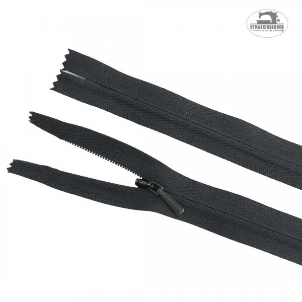 Dolt blixtlås i färgen svart som är 25cm långt