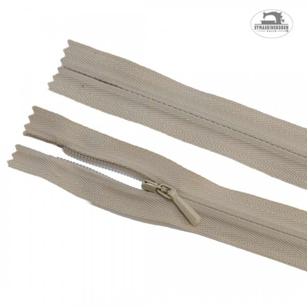 Ett dolt blixtlås med längd 60 cm i färgen beige