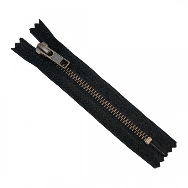 En 12cm lång dragkedja till jeans och kjolar i svart färg